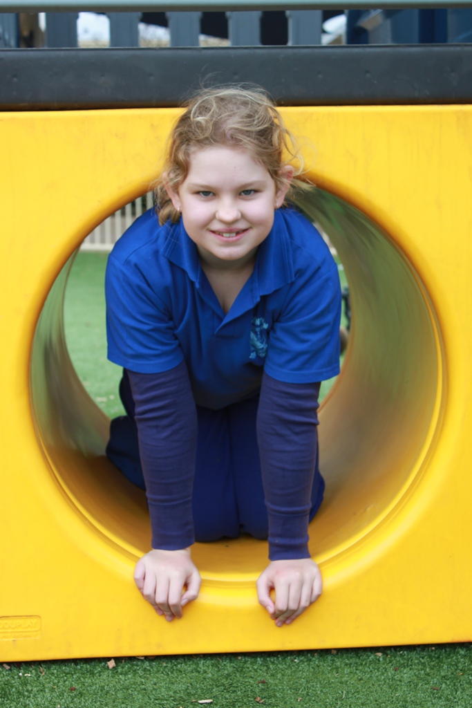 Group of Special Education Program student in playground tunnel