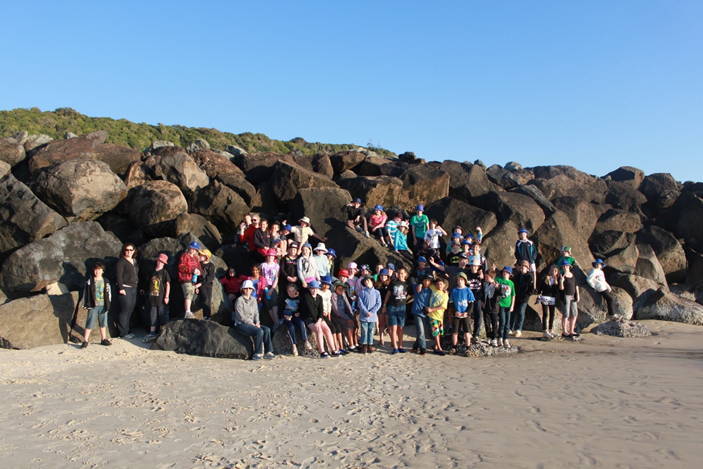 Year 5 students gathered on the beach at Tallebudgera